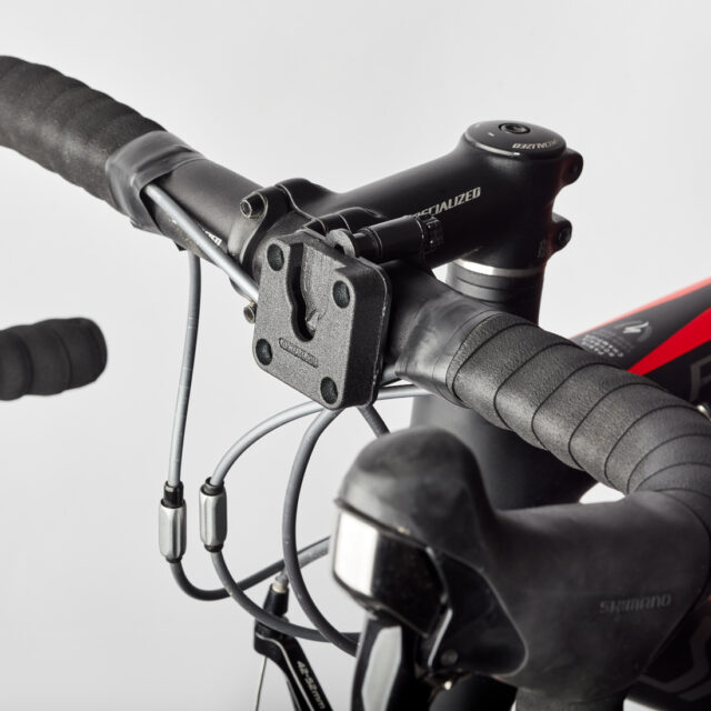 Klick Fast Handlebar Mount for Cameras or Lights attached to the centre of a bike handlebars.